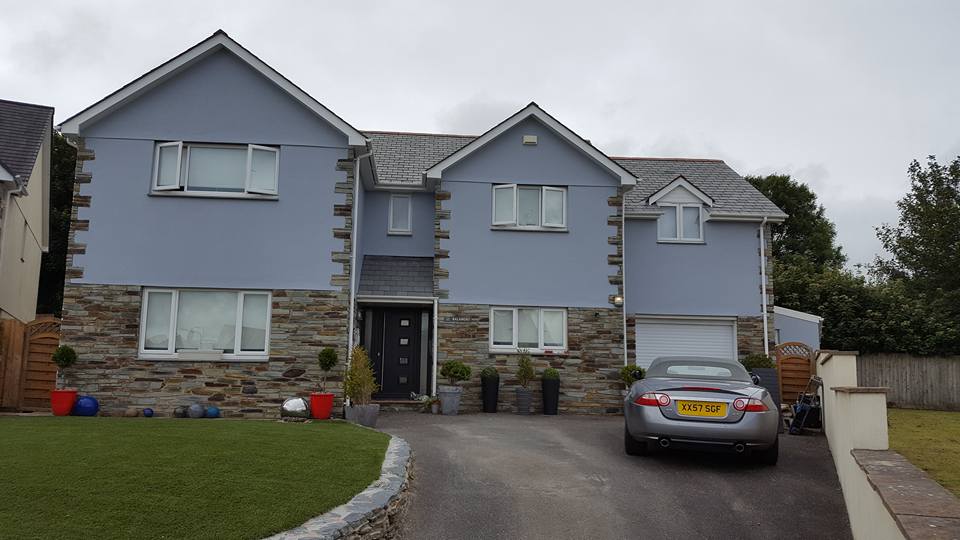 Full exterior house repaint — lavender-grey render over stone base by Inside and Out Maintenance